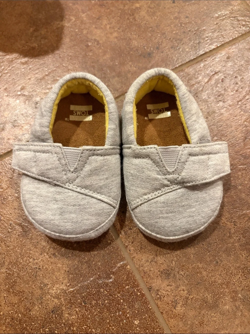 Toms Baby Gray Canvas Slip-On Shoes with Yellow Lining